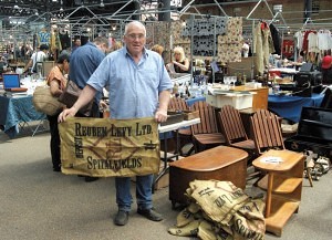 Roy Watt, who has been on the market since it started 10 years ago, is seen holding one of many sacks that he sells which were originally on the market in 1929.