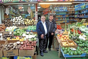 Simon Omar (left) of ‘Brixton Foodland’ Brixton Village Market Row