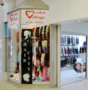 Hair City's prominent new unit at the entrance to Market Village.