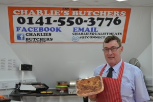 Paul Currie, joint owner of Charlie's Butchers holding one of their delicious homemade pies which are made on site.